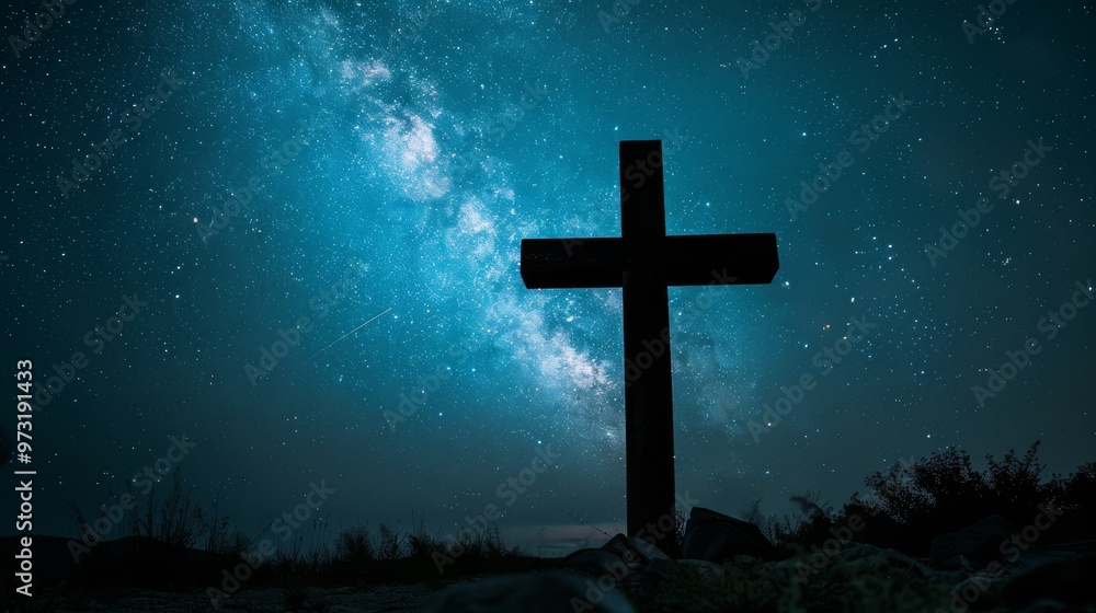 Fototapeta premium Cross silhouette against a starry night sky Close-up photo with clean background