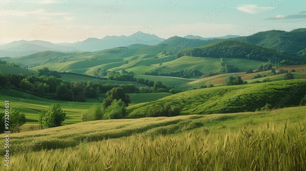 A serene scene featuring a lush green grassy field with majestic mountains as a backdrop A serene scene featuring a lush green grassy field with majestic mountains as a backdrop