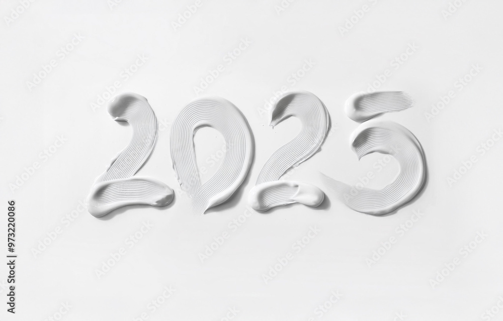 Writing 2025 with white cream, isolated on white background. Creating a swirl 2025 from white. Close up white cream detail photo isolated on white background Writing 2025 with white cream, isolated on white background. Creating a swirl 2025 from white. Close up white cream detail photo isolated on white background