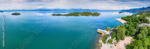 Panoramic view of a scenic coastline with an island in Montenegro, perfect for a summer vacation. photo