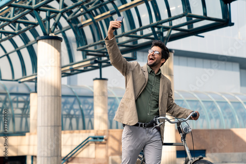 Cheerful Businessman with Bicycle Taking Selfie Outdoors