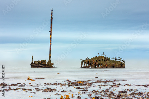 SS or MV Kaffir Clyde puffer wreck rusting north of Ayr Harbour with seaweed foreground - Long exposure photo