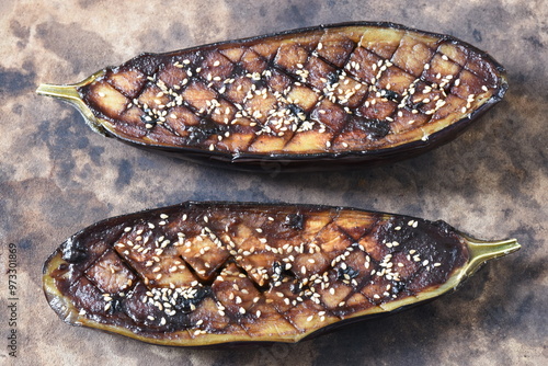 Nasu Dengaku is a classic Japanese side dish made with eggplant sliced in half, scored and brushed with a sweet and savory miso sauce. photo