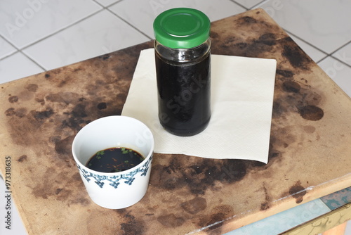 Mentsuyu is a Japanese sauce made from dashi, soy sauce, mirin, and sometimes sake. It's used as a dipping sauce for noodles like soba or udon and can be diluted for soups or dressings. photo