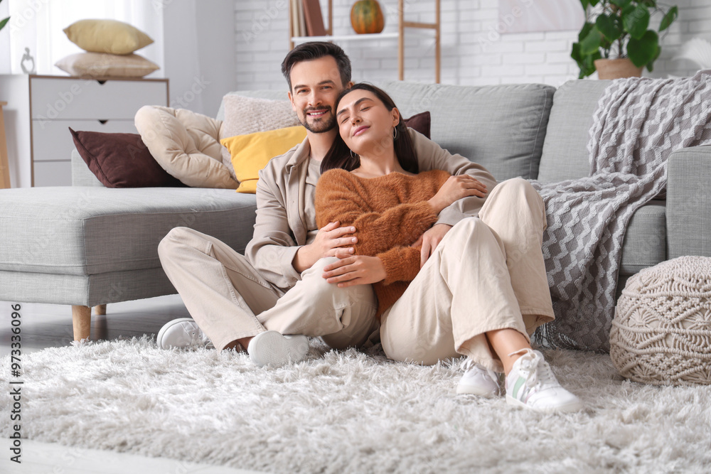 Young couple hugging at home on autumn day Young couple hugging at home on autumn day