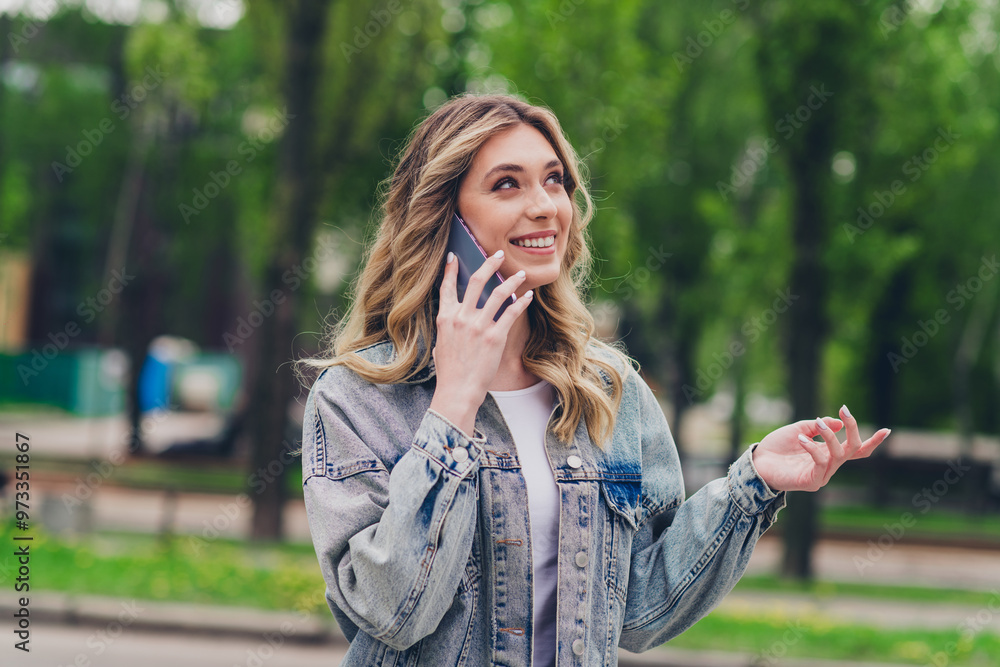 Photo of pretty young woman speaj phone wear denim jacket free time walk fresh air park outdoors Photo of pretty young woman speaj phone wear denim jacket free time walk fresh air park outdoors