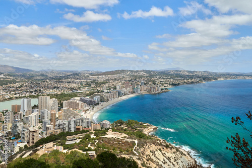 Idyllic Coastal Panorama Calpe Spain Azure Waters Sandy Beaches Iconic Rock Formation Local Flora Sunny Weather Perfect Vacation Spot. Breathtaking Aerial View Calpe Spain Mediterranean Coastline