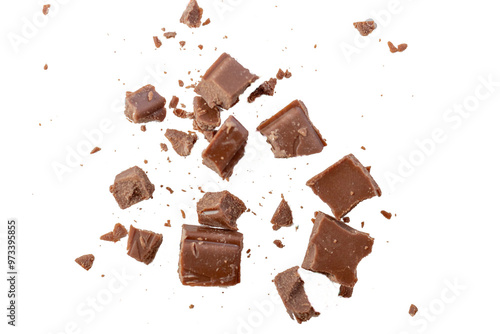 Broken milk chocolate pieces on white or transparent background.Chocolate chips . Ingredients for dessert recipes.Recipe magazines and cookbooks 