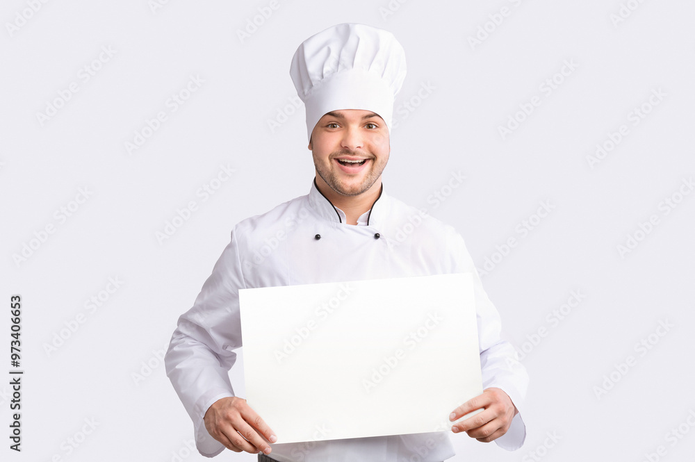 Smiling Chef Man Holding Blank Poster For Text Recommending Recipes Standing Over White Background. Studio Shot, Mockup Smiling Chef Man Holding Blank Poster For Text Recommending Recipes Standing Over White Background. Studio Shot, Mockup