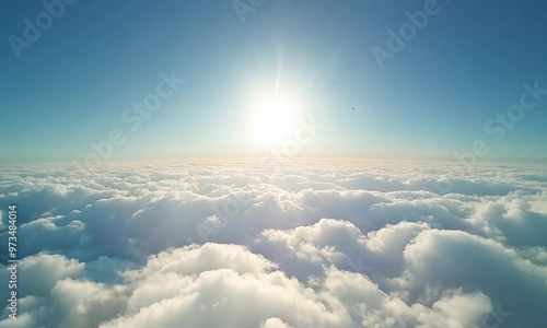 areal shot flying in sky passing through clouds at day time