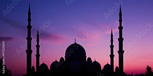 Silhouette of a mosque with a minaret and dome against a serene twilight sky, symbolizing faith and spiritual peace photo