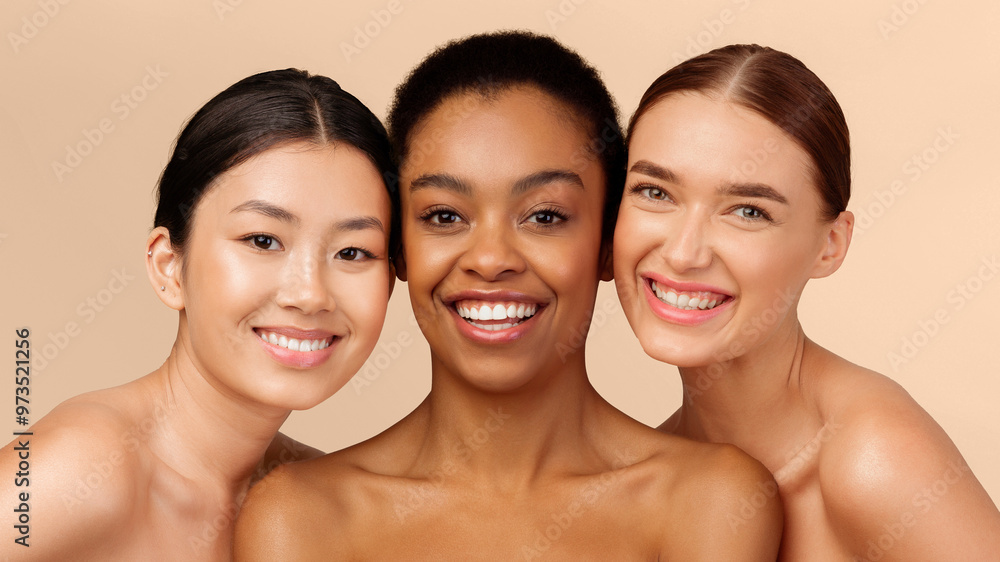 Three Multiracial Models Girls Posing Smiling At Camera Standing On White Studio Background. Skin And Body Care Beauty Concept. Panorama Three Multiracial Models Girls Posing Smiling At Camera Standing On White Studio Background. Skin And Body Care Beauty Concept. Panorama