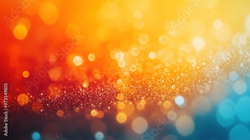 Abstract blurred bokeh background with orange, yellow, and blue colors.