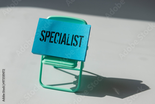 Office stationary and ID card with text SPECIALIST, photo