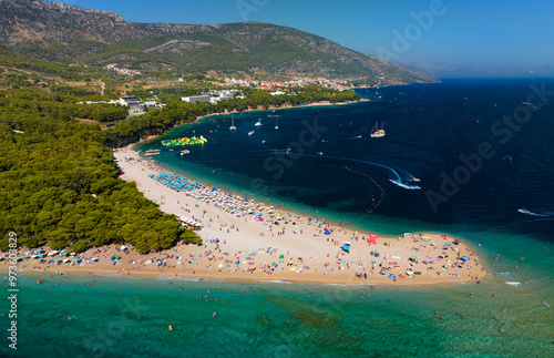 Zlatni Rat beach (Golden Horn beach) is one of the most beautiful beaches in Mediterranean. It is located about 2 km from the town of Bol on the Croatian island of Brac. photo