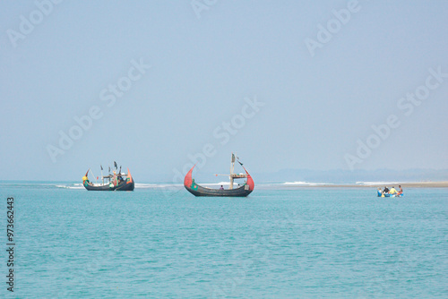 Cox's Bazar Sea Beach, Chittagong, Bangladesh, Traditional Wooden Fishermen's fishing boat, Worlds longest natural sea beach, Bay of Bengal photo