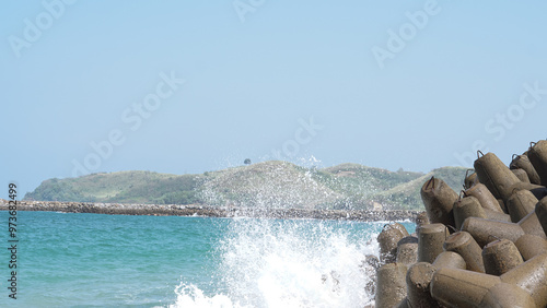 wave breaker along the sea shore photo