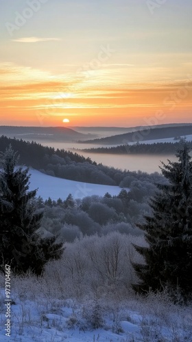 Frosty Winter Landscape with Fog and Distant Sunset