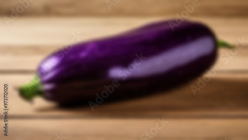  Vibrant purple eggplant on wooden surface photo