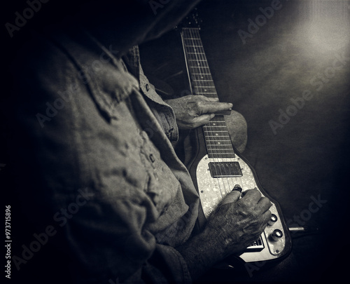 Lap Steel Guitar with Musician playing with a slide and finger picks