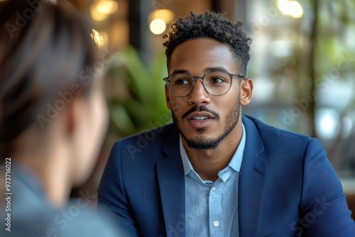 Forward-Thinking Financial Advisor in Cobalt Blue Suit Demonstrating Digital Tools to Gen Z Client