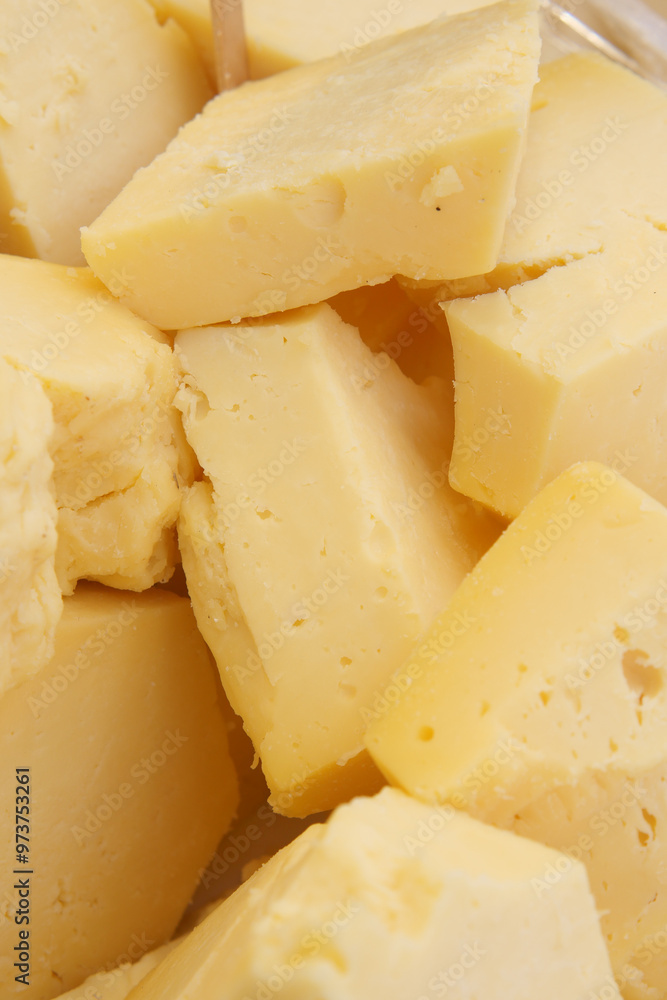 A closeup view of Yellow Cheese Pieces elegantly displayed in an appealing Culinary Setting A closeup view of Yellow Cheese Pieces elegantly displayed in an appealing Culinary Setting