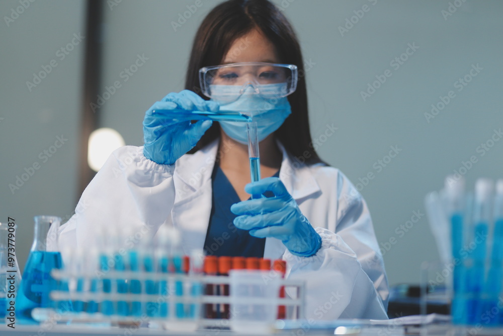 Group of dedicated scientist conduct chemical experiment in medical laboratory, carefully drop precise amount of liquid from pipette into test tube for vaccine drug or antibiotic development. Neoteric Group of dedicated scientist conduct chemical experiment in medical laboratory, carefully drop precise amount of liquid from pipette into test tube for vaccine drug or antibiotic development. Neoteric