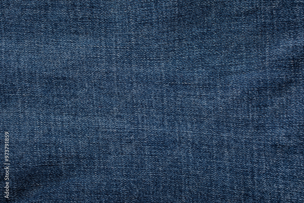 close-up blue denim jeans fabric showing detailed texture with a dark blue color and a stylish design backdrop close-up blue denim jeans fabric showing detailed texture with a dark blue color and a stylish design backdrop