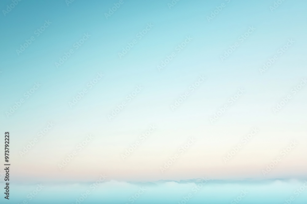 Pastel colored sky fading into white over a layer of fog Pastel colored sky fading into white over a layer of fog