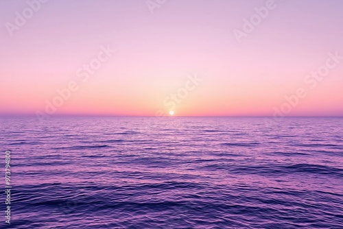 Purple sunset painting the ocean surface at twilight