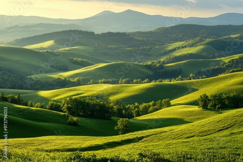 A scenic view of rolling green hills and distant mountains in the Kralicky Sneznik Mountains of Czechia. The landscape is bathed in warm sunlight, creating a serene and peaceful atmosphere , ai