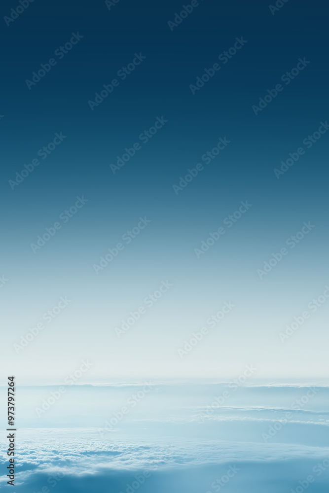 Fototapeta premium Deep blue sky fading into white clouds creating gradient effect
