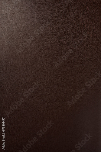 Polished dark brown leather with a smooth surface and fine texture. photo