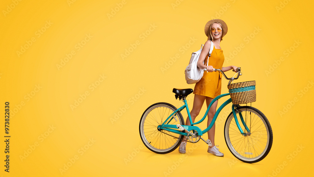Summer Adventures. Portrait Of Cute Teen Hipster Girl With Vintage Bike Over Yellow Studio Background, Panorama With Copy Space Summer Adventures. Portrait Of Cute Teen Hipster Girl With Vintage Bike Over Yellow Studio Background, Panorama With Copy Space