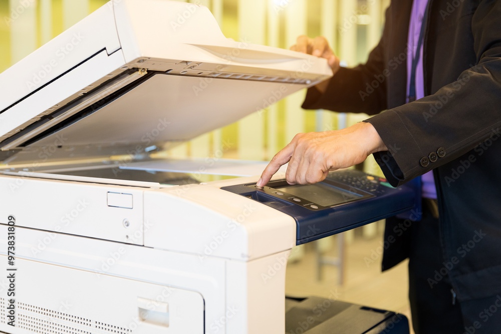 Man use copier or photocopier or photocopy in office workplace is equipment for copy duplicate Xerox or scanner to scanning document or printer for printing paper. Man use copier or photocopier or photocopy in office workplace is equipment for copy duplicate Xerox or scanner to scanning document or printer for printing paper.