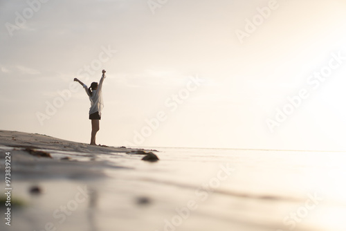 Woman at Sunset on the Beach