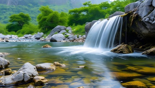 Serene river scene with a flowing waterfall and scattered rocks amidst a tranquil, clear water setting