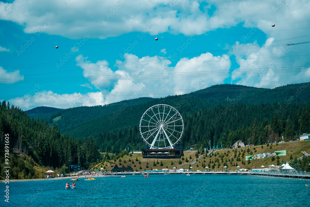 A sunny day at the lakeside amusement park with a vibrant Ferris wheel and visitors enjoying water activities A sunny day at the lakeside amusement park with a vibrant Ferris wheel and visitors enjoying water activities