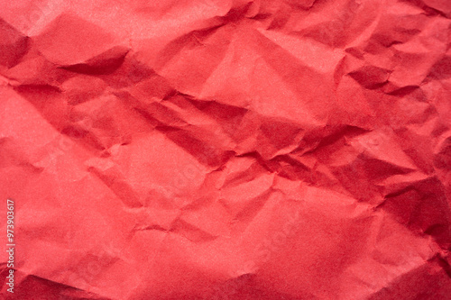 Full frame shot of crumpled red paper sheet texture and background.