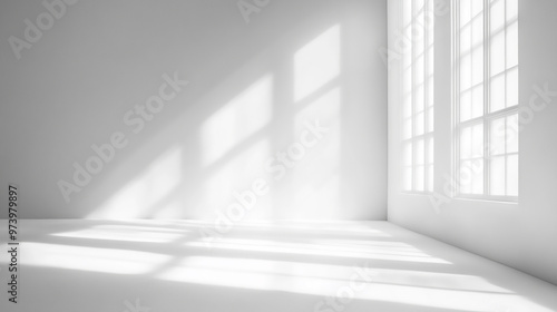 White studio backdrop for presenting products with gray room and window shadows for a blurred background display.