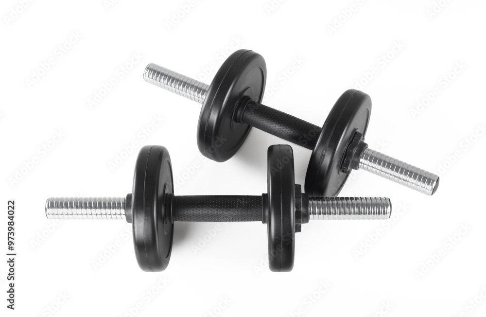 Fototapeta premium Sport and fitness - Two dumbbells with two weights in white