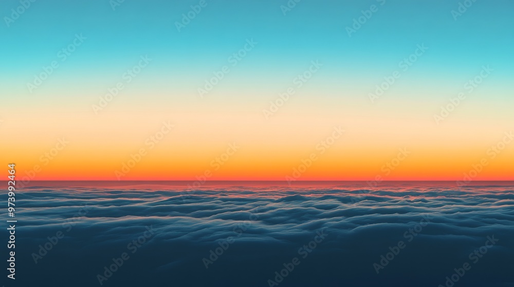 Naklejka premium The sky slowly dims before dusk, with layers of fading orange and blue mixing together, the horizon softly glowing in the distance.