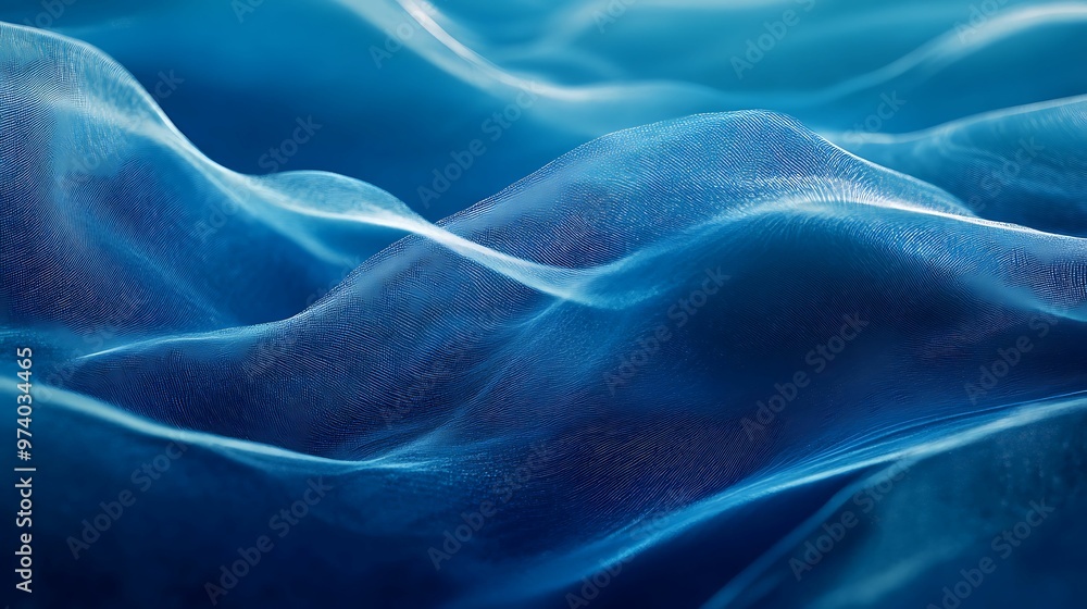 Obraz premium An abstract image depicting smooth, flowing blue waves with delicate textures, resembling fabric or water, creating a calm and serene atmosphere.