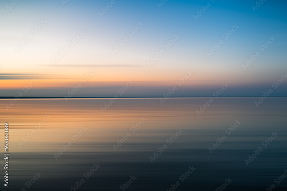 Abstract blurred ICM image of colorful sunset over a lake. Abstract blurred ICM image of colorful sunset over a lake.