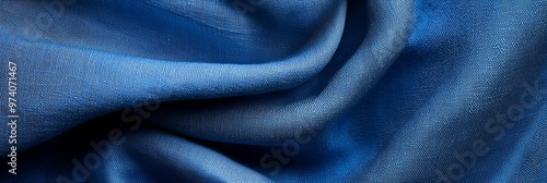  A tight shot of a blue fabric, textured with a thin line of lighter fabric running through its core