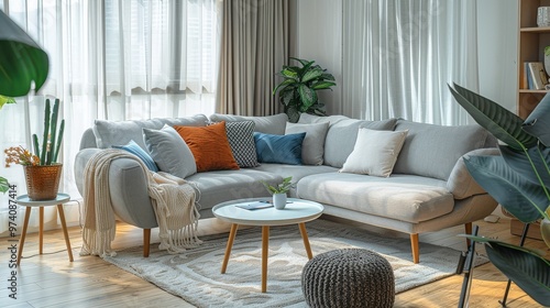 Stylish grey fabric sofa with chaise longue, elegant armchair, white coffee table with colorful cushions, Scandinavian-inspired cozy living room. photo