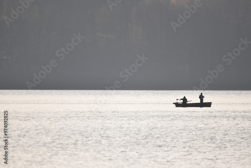 Fishermen catching fish from a boat