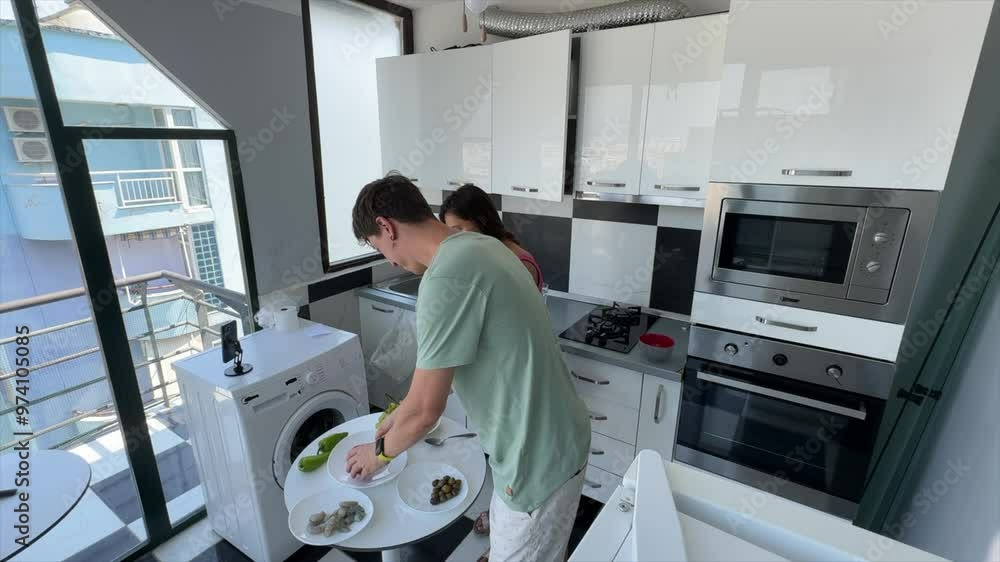 A contemporary kitchen cooking scene featuring a young adult engaged in culinary activities A contemporary kitchen cooking scene featuring a young adult engaged in culinary activities