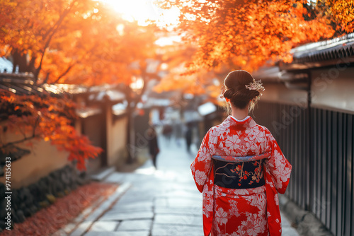 Happy young traveler woman wearing Japanese traditional kimono enjoying beautiful in Autumn season photo