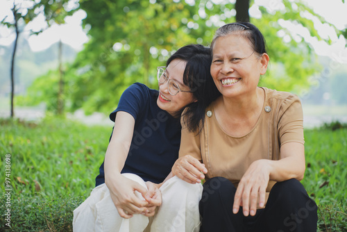 Canvas-taulu Young Asian woman with her mother in the park